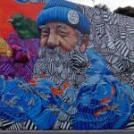 O mais recente mural de OzeArv preenche de cor mais de 100 metros do muro que dá as boas-vindas a quem entra na Vila de Odeceixe.